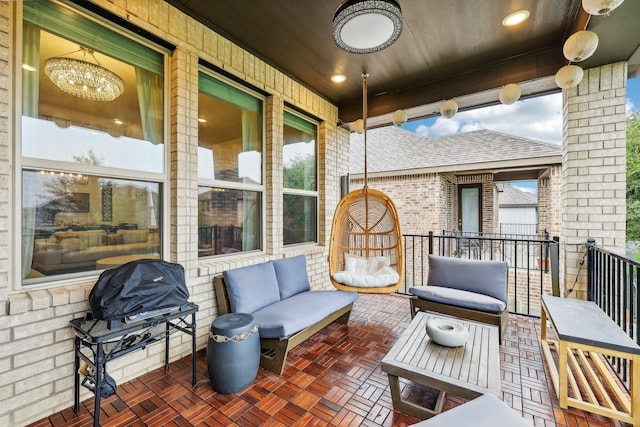 view of patio with a balcony and an outdoor living space