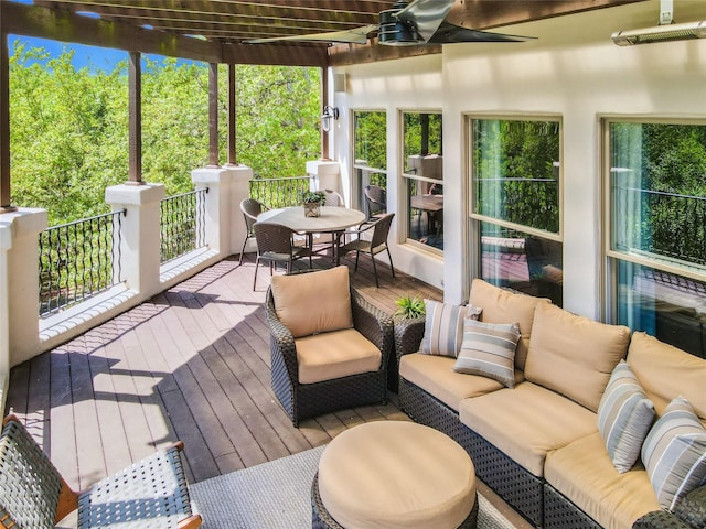 deck with an outdoor hangout area and a ceiling fan