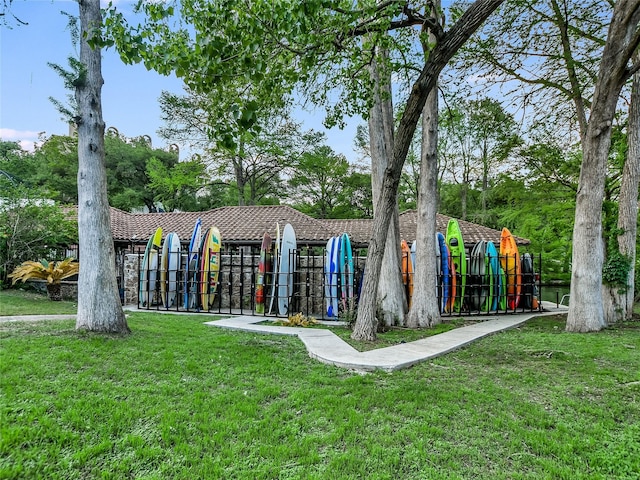 view of home's community with a lawn