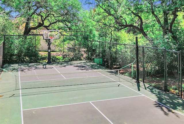 view of sport court featuring tennis court