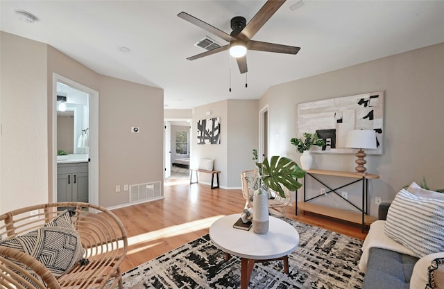 9504 Sanford Dr, Austin, TX 78748 - living area featuring a ceiling fan and light wood-style flooring
