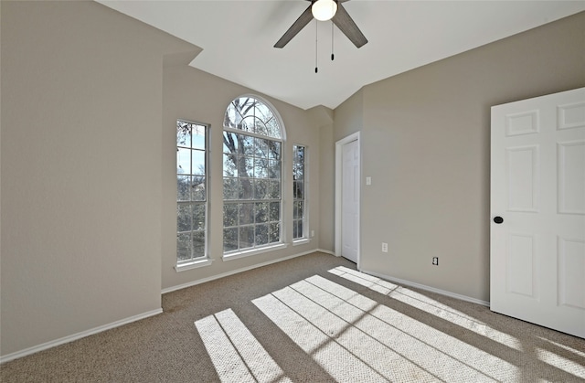 empty room featuring ceiling fan and carpet floors