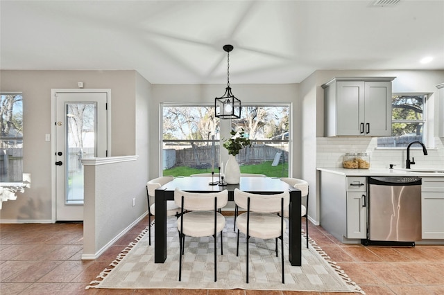 tiled dining area with sink