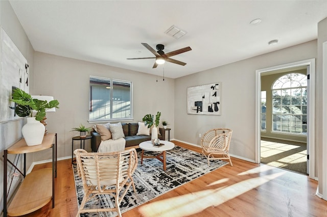 9504 Sanford Dr, Austin, TX 78748 - living area featuring healthy amount of natural light, ceiling fan, and wood finished floors
