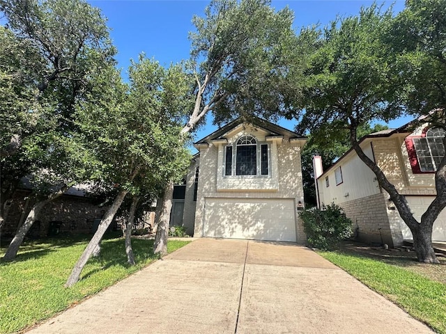 9504 Sanford Dr, Austin, TX 78748 - traditional home featuring brick siding, a garage, driveway, and a front yard