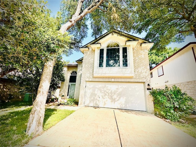 9504 Sanford Dr, Austin, TX 78748 - view of front facade featuring brick siding, an attached garage, and driveway
