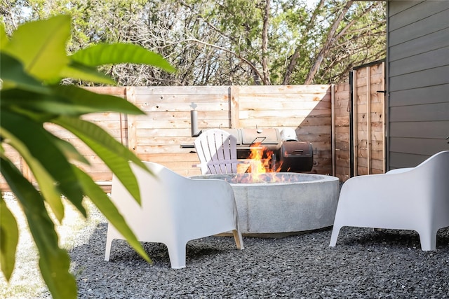 view of patio / terrace with a fire pit