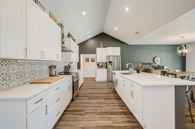 kitchen featuring white cabinets, an island with sink, appliances with stainless steel finishes, and sink