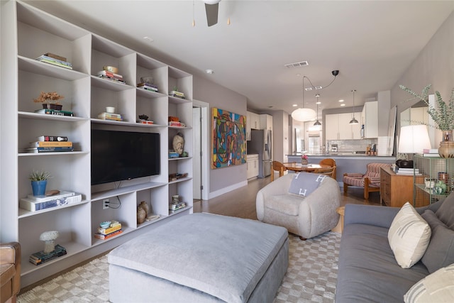 living room with ceiling fan