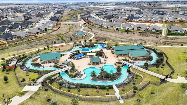 488 Pepperbark Loop, Buda, TX 78610 - aerial view of property's location with a pool and nearby suburban area