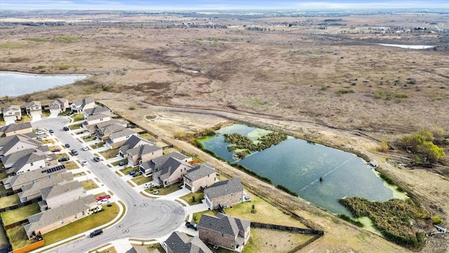 488 Pepperbark Loop, Buda, TX 78610 - aerial overview of property's location with a nearby body of water and nearby suburban area