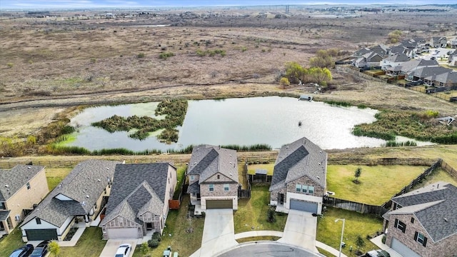 488 Pepperbark Loop, Buda, TX 78610 - aerial perspective of suburban area featuring a nearby body of water