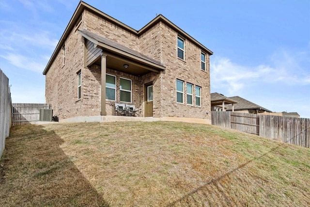 488 Pepperbark Loop, Buda, TX 78610 - back of house with brick siding, central AC unit, and a patio
