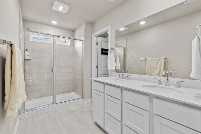 488 Pepperbark Loop, Buda, TX 78610 - bathroom featuring a stall shower and double vanity