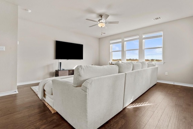 488 Pepperbark Loop, Buda, TX 78610 - living room with ceiling fan, baseboards, and dark wood-style floors