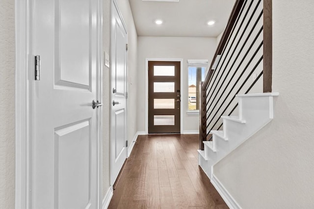 488 Pepperbark Loop, Buda, TX 78610 - foyer featuring dark wood-style floors, stairway, recessed lighting, and baseboards
