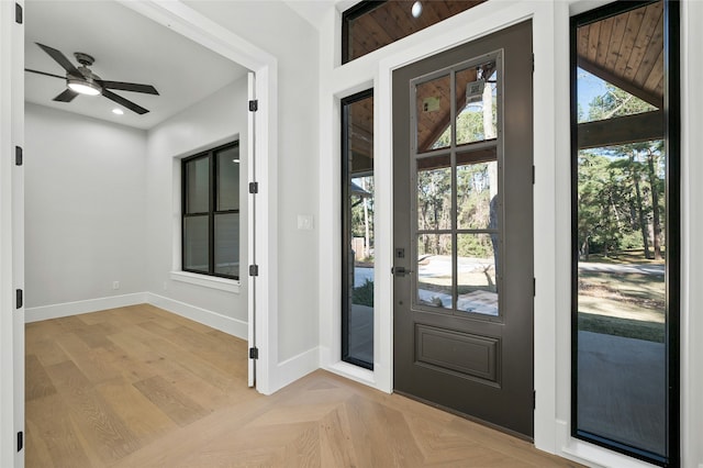 entryway featuring ceiling fan and light parquet flooring