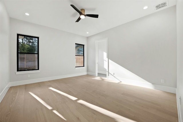 unfurnished room featuring light wood-type flooring and ceiling fan