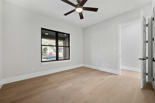 unfurnished room featuring ceiling fan and light hardwood / wood-style floors