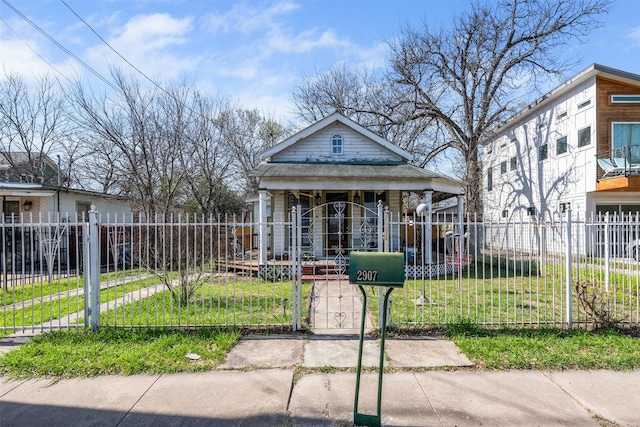 bungalow featuring a front lawn and a porch