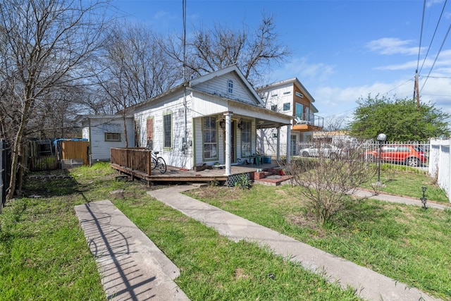 bungalow-style home featuring a porch and a front yard