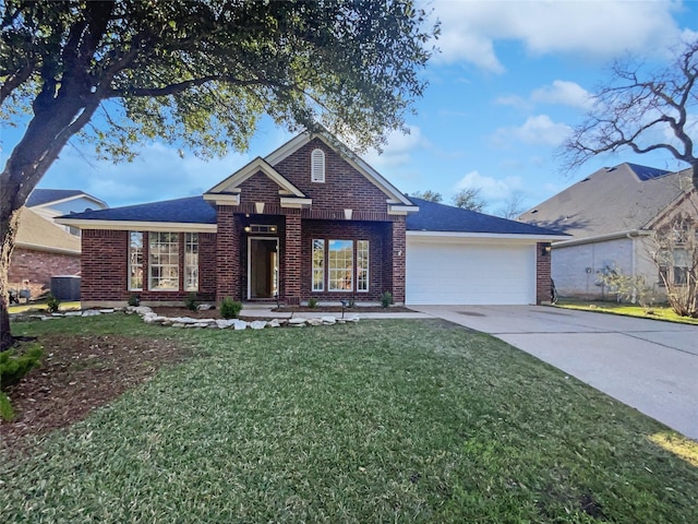 view of front of property featuring a garage, cooling unit, and a front lawn