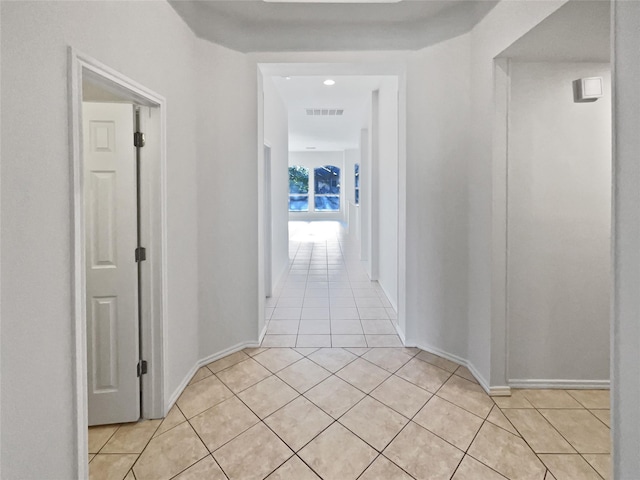 corridor featuring light tile patterned flooring