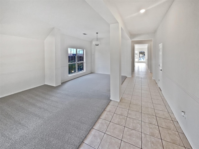 hall with light tile patterned flooring