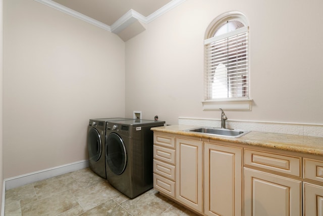 laundry area featuring cabinets, sink, crown molding, and independent washer and dryer