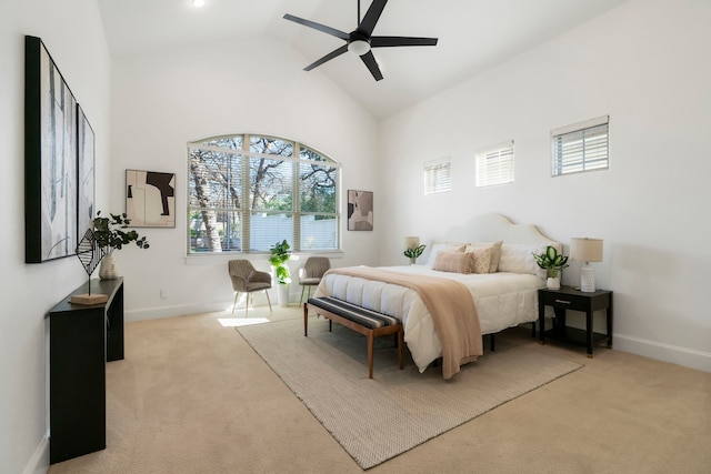 carpeted bedroom featuring ceiling fan, high vaulted ceiling, and multiple windows