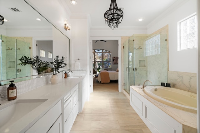 bathroom featuring vanity, crown molding, independent shower and bath, and a notable chandelier