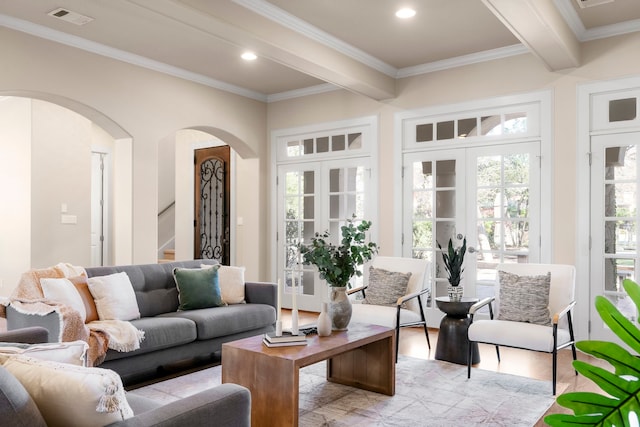 living room featuring crown molding, light hardwood / wood-style floors, beam ceiling, and french doors