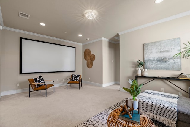 cinema room with light colored carpet and ornamental molding