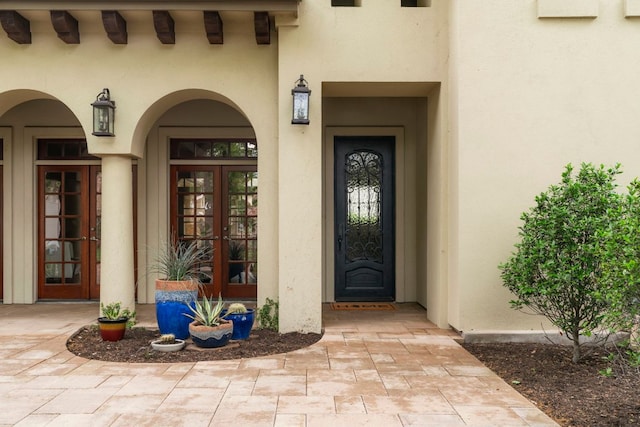2407 Enfield Rd Unit A, Austin, TX 78703 - view of exterior entry featuring french doors and stucco siding