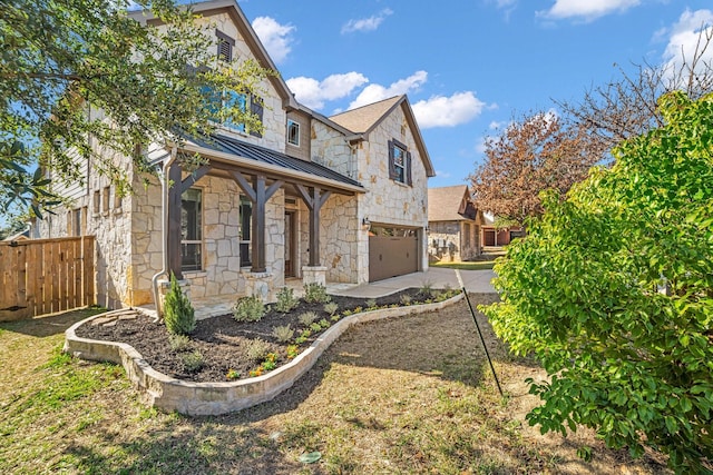 view of front of property with a garage