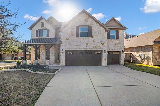 view of front of property featuring a garage and covered porch