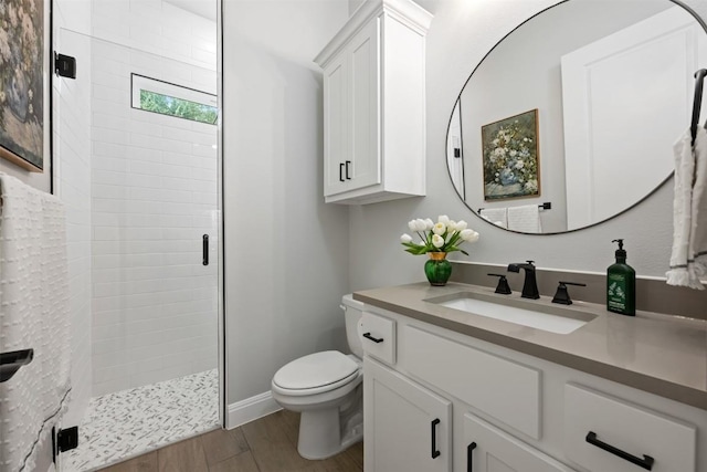 210 Miranda Way, Georgetown, TX 78633 - bathroom featuring a shower stall, vanity, and wood finished floors