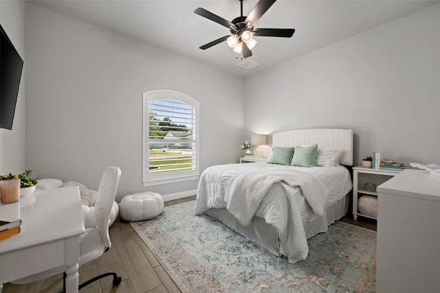 bedroom featuring ceiling fan and wood-type flooring