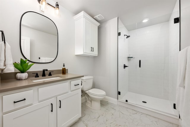 bathroom featuring an enclosed shower, vanity, and toilet