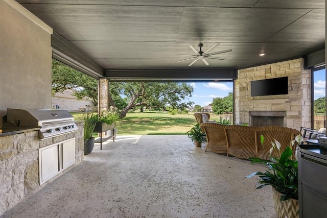 210 Miranda Way, Georgetown, TX 78633 - view of patio featuring an outdoor stone fireplace, an outdoor kitchen, and a ceiling fan