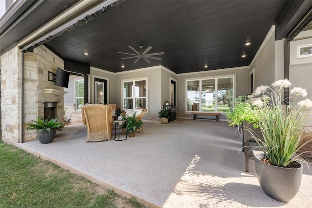 210 Miranda Way, Georgetown, TX 78633 - view of patio featuring an outdoor stone fireplace and ceiling fan