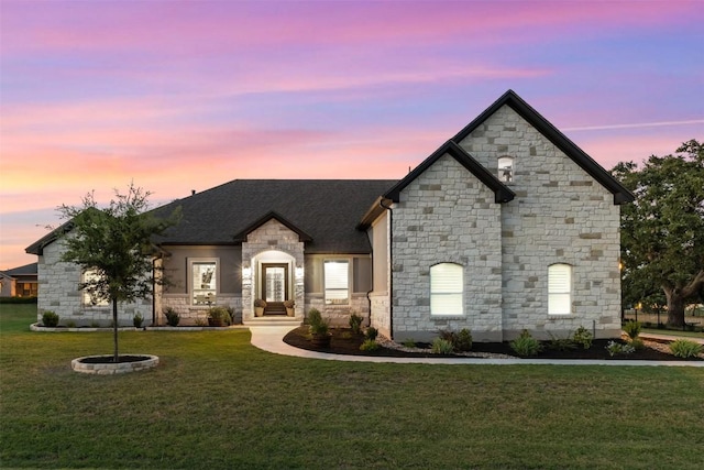 210 Miranda Way, Georgetown, TX 78633 - french country home featuring stone siding, a yard, and a shingled roof