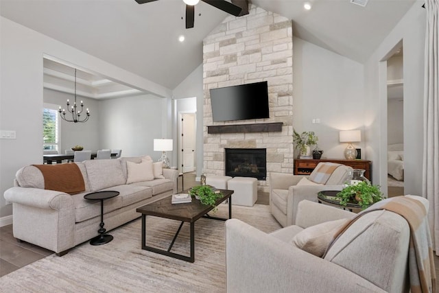 210 Miranda Way, Georgetown, TX 78633 - living area with ceiling fan, vaulted ceiling, a chandelier, a fireplace, and wood finished floors