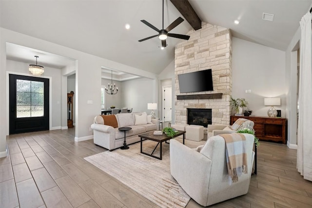 210 Miranda Way, Georgetown, TX 78633 - living area with ceiling fan, beamed ceiling, wood finished floors, a fireplace, and a chandelier