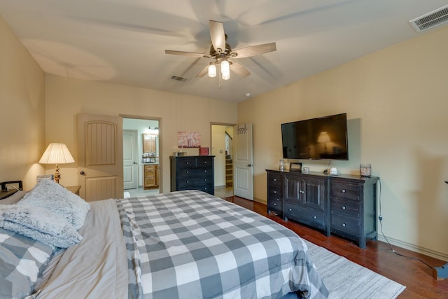 bedroom with ceiling fan and dark hardwood / wood-style flooring