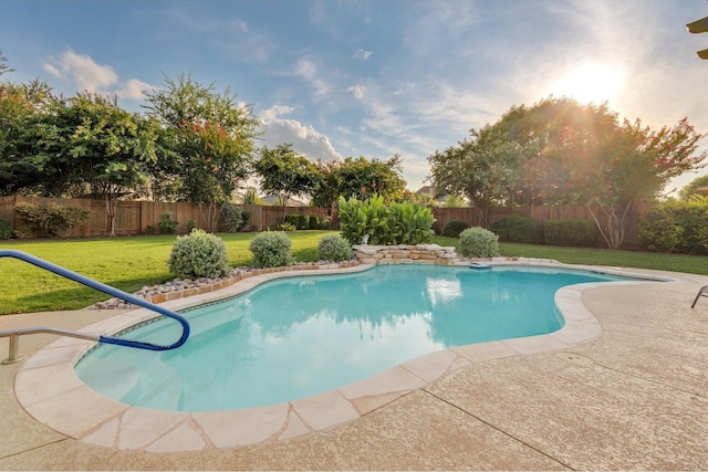 view of swimming pool featuring a fenced backyard, a fenced in pool, and a yard