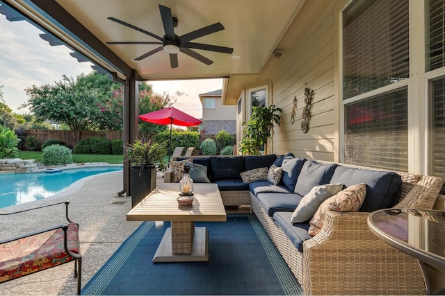 view of patio / terrace with ceiling fan, outdoor lounge area, fence, and a fenced in pool