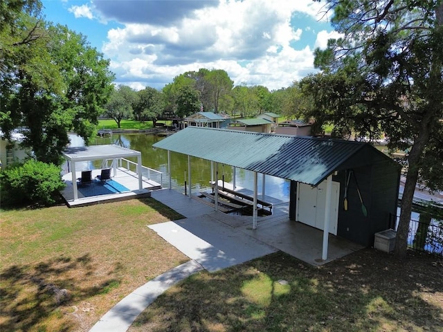 614 E Briarway Dr, Granite Shoals, TX 78654 - dock featuring boat lift, a yard, and a water view