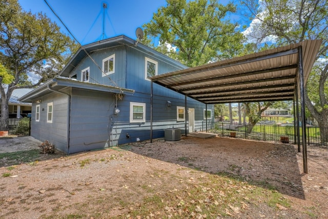 614 E Briarway Dr, Granite Shoals, TX 78654 - view of side of home featuring a carport, driveway, and cooling unit