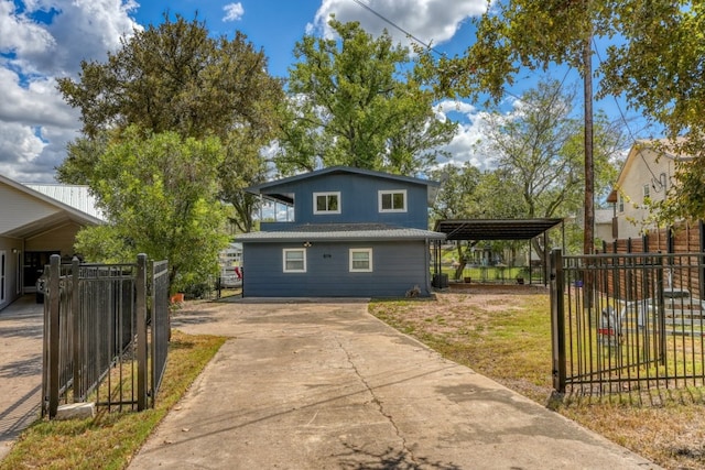 614 E Briarway Dr, Granite Shoals, TX 78654 - view of front of house featuring concrete driveway and a carport